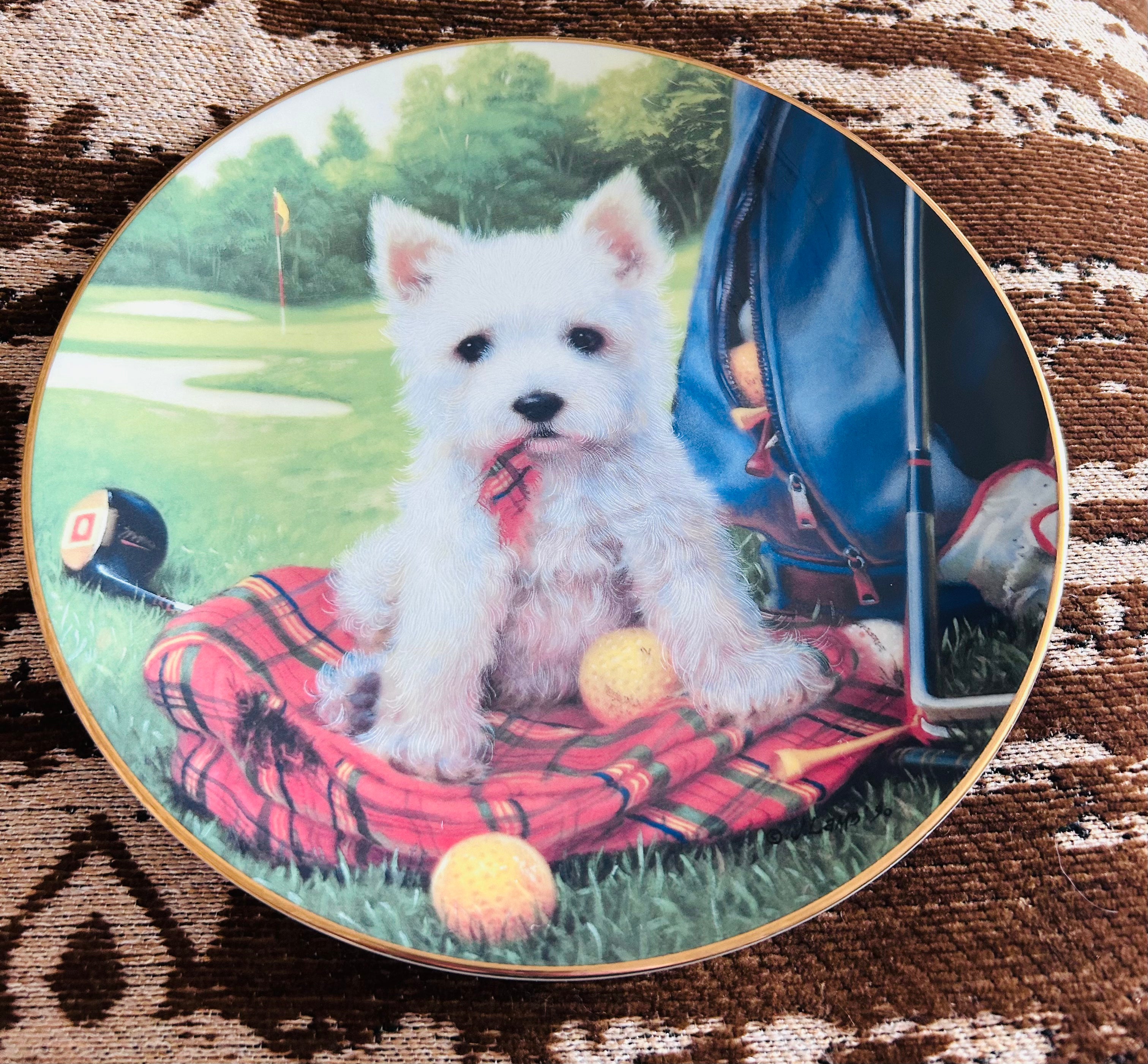 the Good Sports series by Jim Lamb, dated 1990.

Vintage Jim Lamb Hole In One Westie Dog Golf Collector Plate 1990 Limited Edition