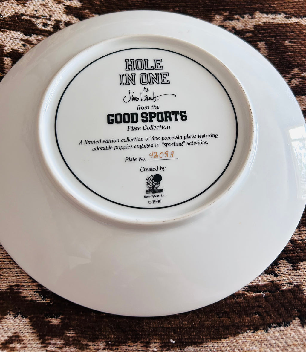 the Good Sports series by Jim Lamb, dated 1990.

Vintage Jim Lamb Hole In One Westie Dog Golf Collector Plate 1990 Limited Edition