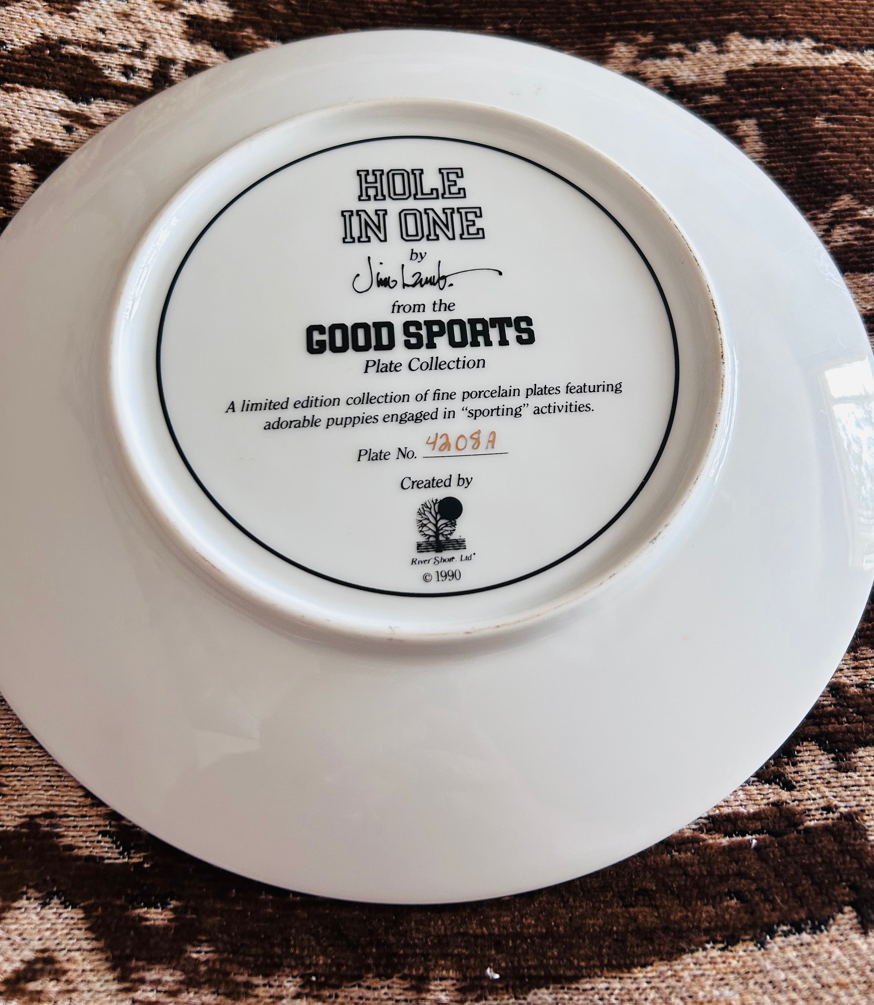 the Good Sports series by Jim Lamb, dated 1990.

Vintage Jim Lamb Hole In One Westie Dog Golf Collector Plate 1990 Limited Edition