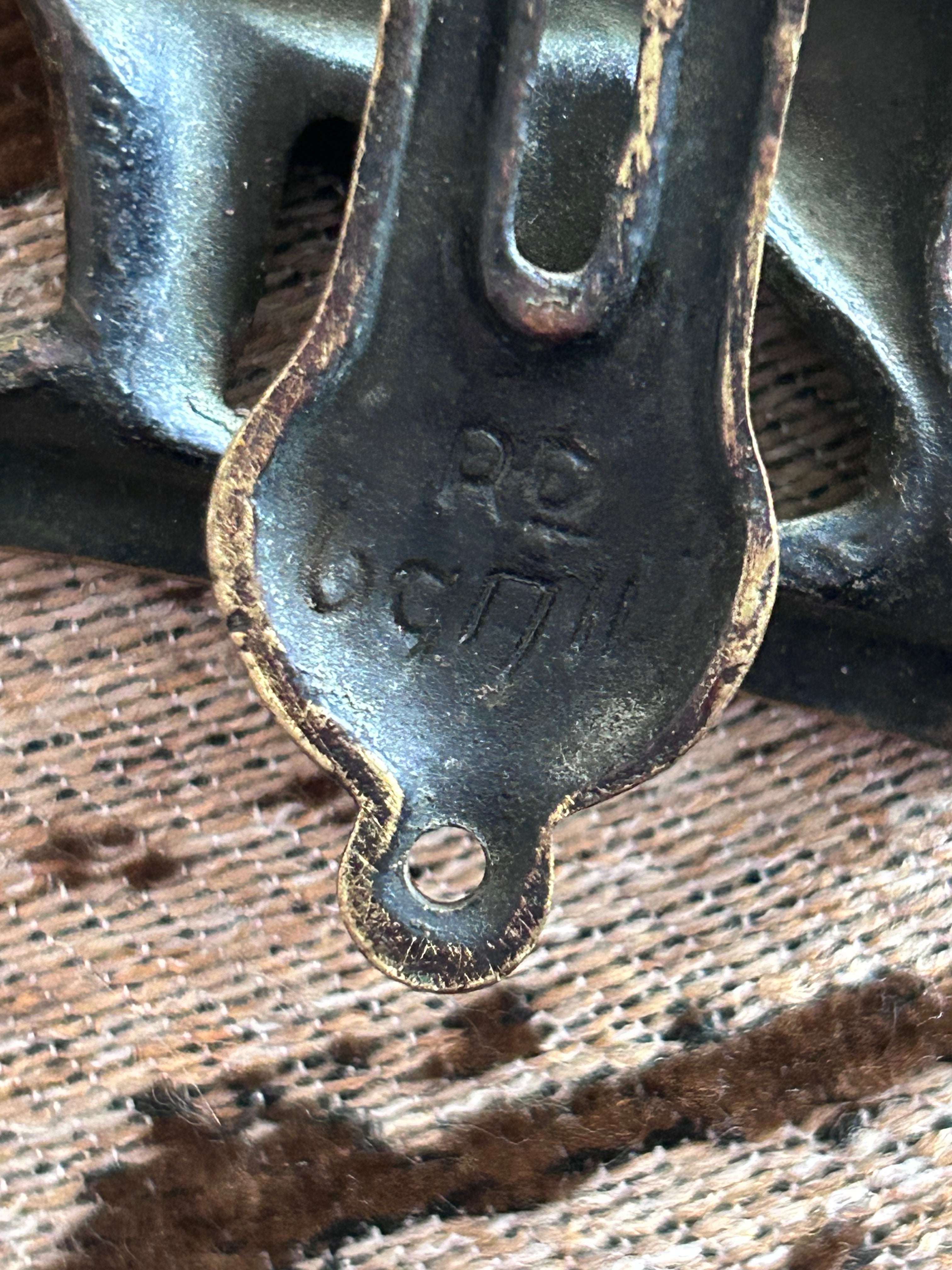 A striking vintage brass door knocker featuring a beautifully detailed English Setter hunting dog design, 1922-1930
